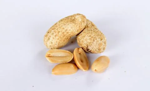 Peanuts isolated on a white background. There are separate peanut kernels. cl Stock Photos