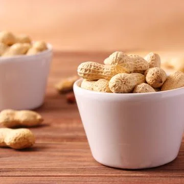 Peanuts on a light background close-up Photos