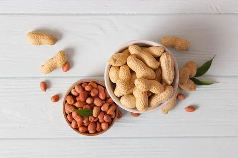 Peanuts on a light background close-up Photos
