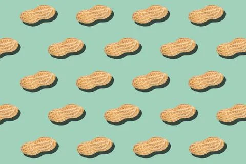 Peanuts minimal pattern on light green background Stock Photos