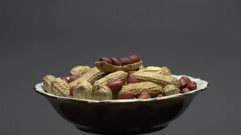 Peanuts. Mixed Peanuts in rotation. Snack closeup. Selective focus. Stock Footage 102281081