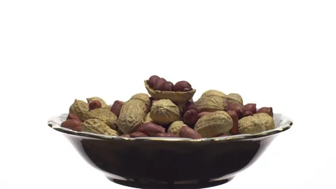 Peanuts. Mixed Peanuts in rotation. Snack closeup.  Isolated on white. Stock Footage 102281133
