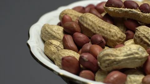 Peanuts. Mixed Peanuts in rotation. Snack closeup. Selective focus. Stock Footage 102281346