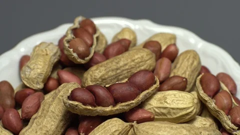 Peanuts. Mixed Peanuts in rotation. Snack closeup. Selective focus. Stock Footage 102281610