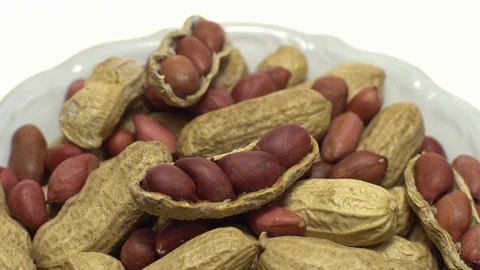 Peanuts. Mixed Peanuts in rotation. Snack closeup.  Isolated on white. Stock Footage 102281675