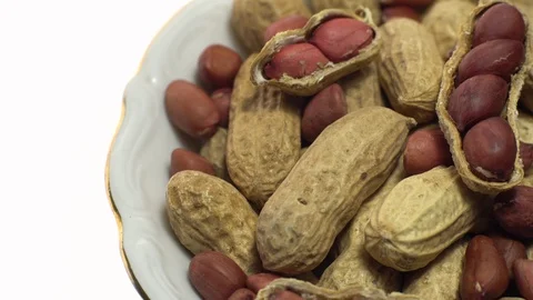 Peanuts. Mixed Peanuts in rotation. Snack closeup.  Isolated on white. Stock Footage 102281947