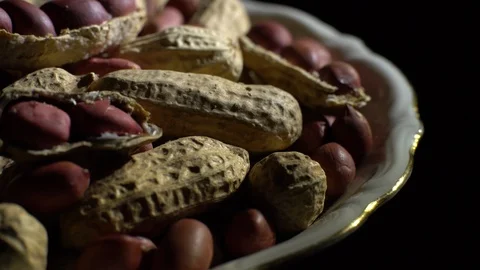 Peanuts. Mixed Peanuts in rotation. Snack closeup. black background. Stock Footage 102290409