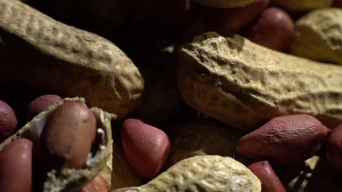 Peanuts. Mixed Peanuts in rotation. Snack closeup. black background. Stock Footage 102290467