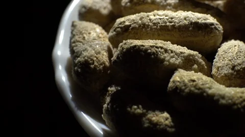 Peanuts. Mixed Peanuts in rotation. Snack closeup. black background. Stock Footage 102290747