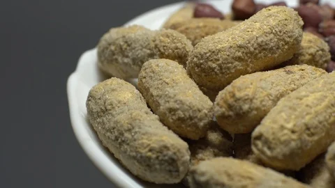 Peanuts. Mixed Peanuts in rotation. Snack closeup. Selective focus. Stock Footage 102290995