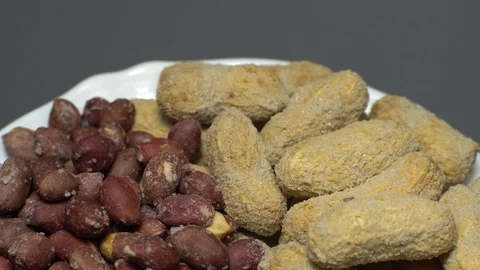 Peanuts. Mixed Peanuts in rotation. Snack closeup. Selective focus. Stock Footage 102291115