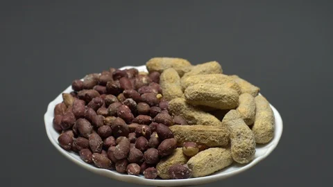Peanuts. Mixed Peanuts in rotation. Snack closeup. Selective focus. Stock Footage 102291185