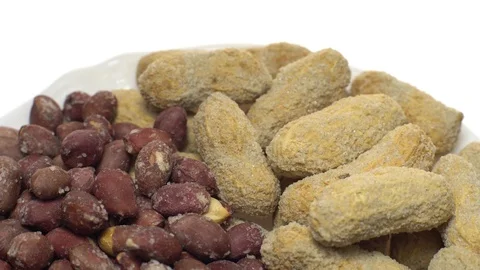 Peanuts. Mixed Peanuts in rotation. Snack closeup.  Isolated on white. Stock Footage 102291190