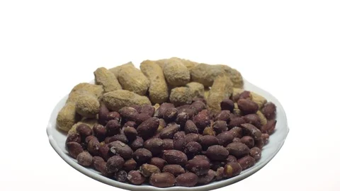 Peanuts. Mixed Peanuts in rotation. Snack closeup.  Isolated on white. Stock Footage 102291271