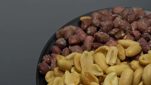 Peanuts. Mixed Peanuts in rotation. Snack closeup. Selective focus. Stock Footage 102291330
