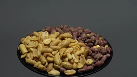 Peanuts. Mixed Peanuts in rotation. Snack closeup. Selective focus. Stock Footage 102291377