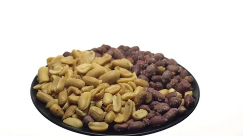 Peanuts. Mixed Peanuts in rotation. Snack closeup.  Isolated on white. Stock Footage 102291448