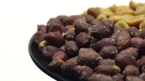 Peanuts. Mixed Peanuts in rotation. Snack closeup.  Isolated on white. Stock Footage 102291490