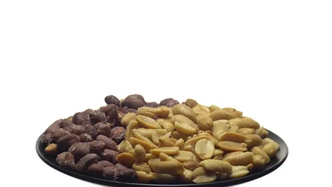 Peanuts. Mixed Peanuts in rotation. Snack closeup.  Isolated on white. Stock Footage 102291548