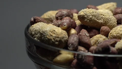 Peanuts. Mixed Peanuts in rotation. Snack closeup. Selective focus. Stock Footage 102339237