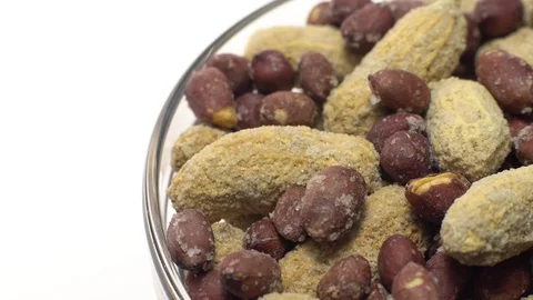 Peanuts. Mixed Peanuts in rotation. Snack closeup.  Isolated on white. Stock Footage 102339293