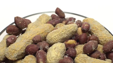 Peanuts. Mixed Peanuts in rotation. Snack closeup.  Isolated on white. Stock Footage 102339474