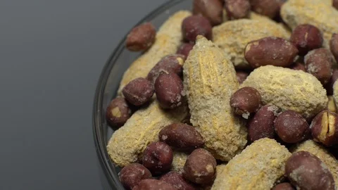 Peanuts. Mixed Peanuts in rotation. Snack closeup. Selective focus. Stock Footage 102339503
