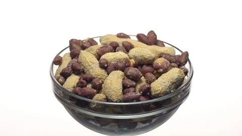 Peanuts. Mixed Peanuts in rotation. Snack closeup.  Isolated on white. Stock Footage 102339597