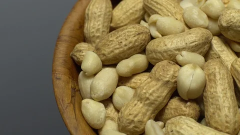 Peanuts. Mixed Peanuts in rotation. Snack closeup. Selective focus. Stock Footage 102339764