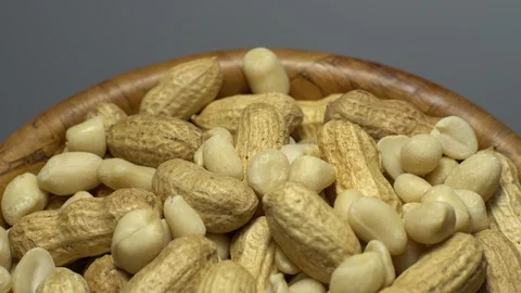 Peanuts. Mixed Peanuts in rotation. Snack closeup. Selective focus. Stock Footage 102339797