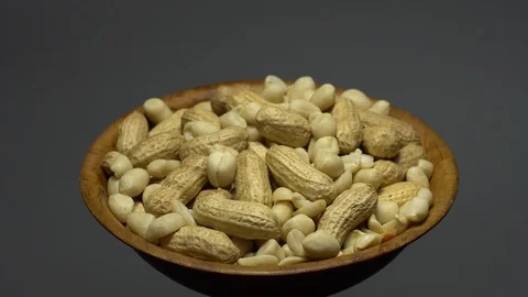 Peanuts. Mixed Peanuts in rotation. Snack closeup. Selective focus. Stock Footage 102339913