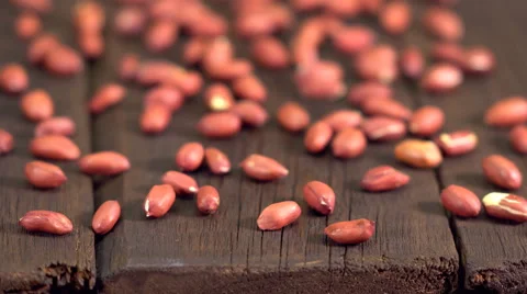 Peanuts on an old wooden table Stock Footage 63165368