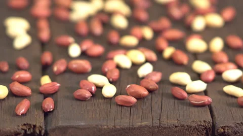 Peanuts on an old wooden table Stock Footage 63166120