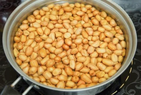 Peanuts or Groundnut Deep Fried in A Hot Boiling Oil Stock Photos