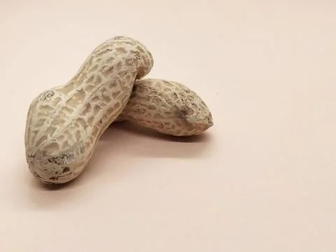 Peanuts on orange background isolate Stock Photos