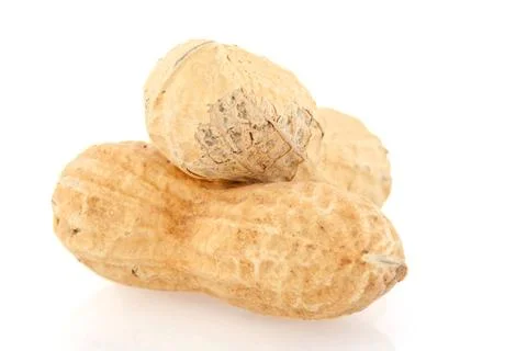 Peanuts a pair of burned peanuts isolated over white background Copyright:... Fotos Stock