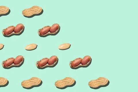Peanuts pattern on light green background backdrop food nut texture Stock Photos