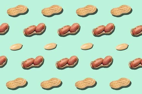 Peanuts pattern on light green background backdrop food nut texture Stock Photos