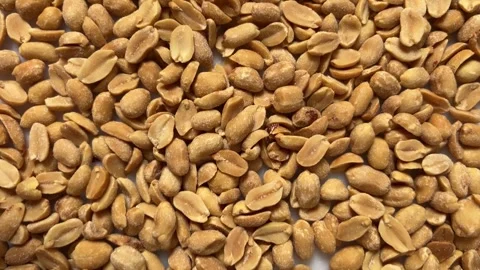 Peanuts peeled, roasted and salted in top view Video stock 310754132
