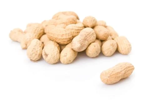 Peanuts pile isolated on a white background. Stock Photos