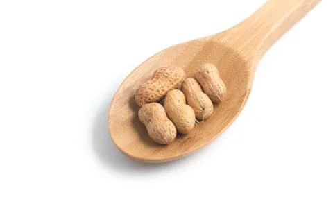 Peanuts pile. Shell Seeds into a spoon Stock Photos