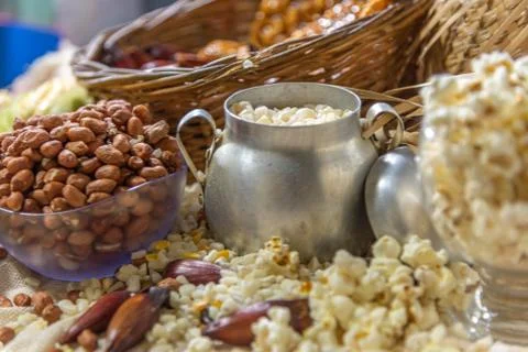 Peanuts, popcorn, pine nuts and corn for hominy prepared for food for St. Joh Stockfoto's