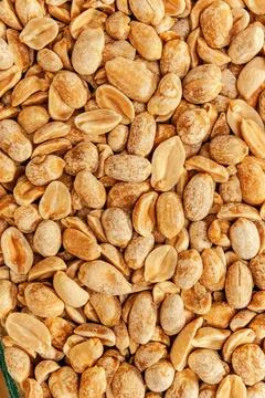 Peanuts Roasted peanuts in closeup on the white background Copyright: xZoo... Stock Photos