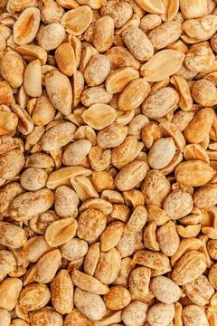 Peanuts Roasted peanuts in closeup on the white background Copyright: xZoo... Foto stock