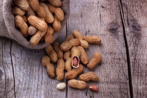Peanuts in a sack Stock Photos