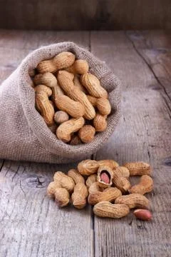 Peanuts in a sack Stock Photos