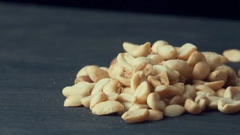 Peanuts with salt spins on a dark background Stock Footage 119581848
