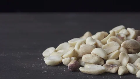 Peanuts with salt spins on a dark background Stock Footage 119960963