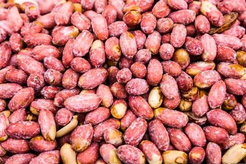Peanuts, salted, baked, as background. Stock Photos