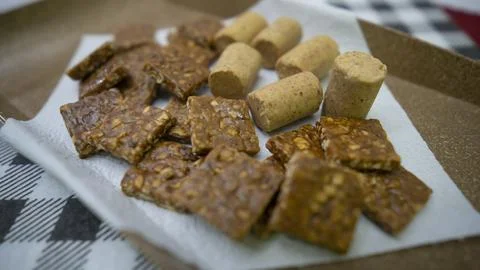 Peanuts in the shape of sweets, pacoca, cornmeal cake and peanut butter on bread Stock Photos